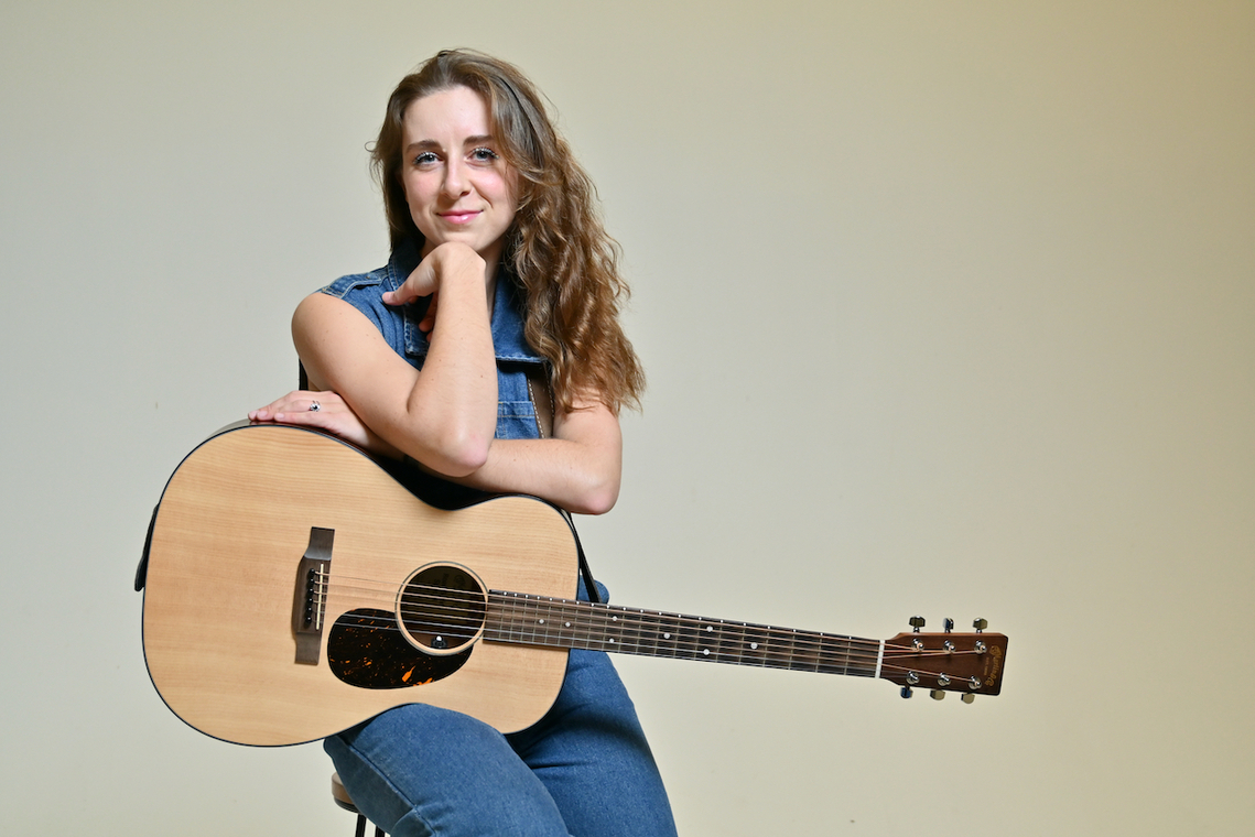 Rachel Hill with her guitar